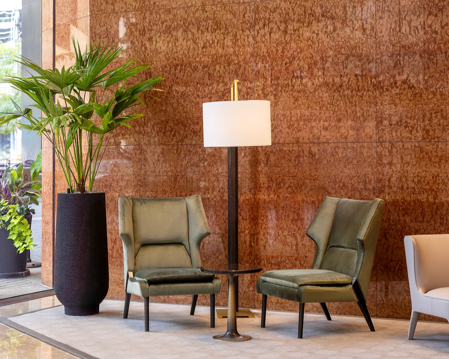 A luxury interior design example featuring a large indoor plant in a high-end lobby.