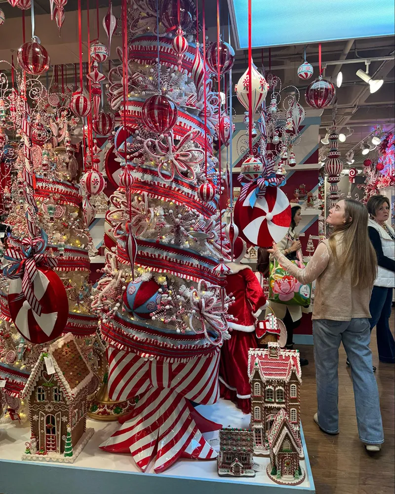 Whimsical peppermint-themed holiday display with red and white stripes.
