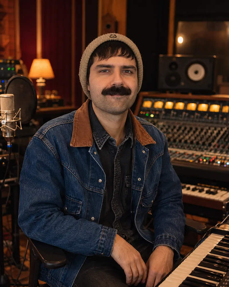 Portrait of Sal in a music studio.