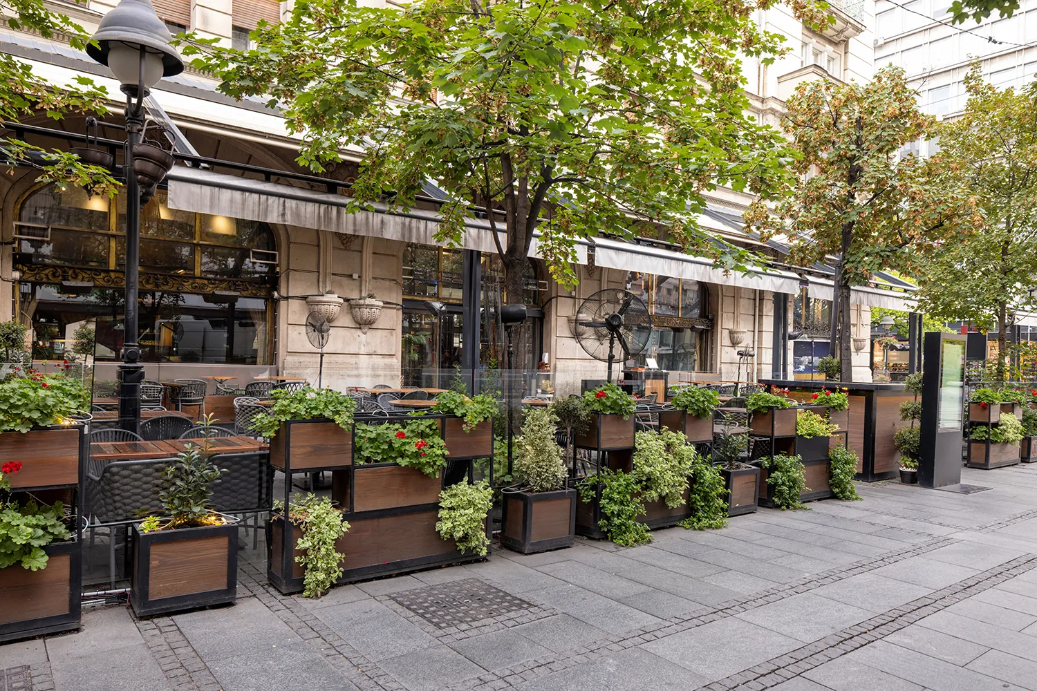 Define the Space, Protect the Path Business entryway planters and commercial outdoor planters guiding pedestrian flow at a Chicago sidewalk café