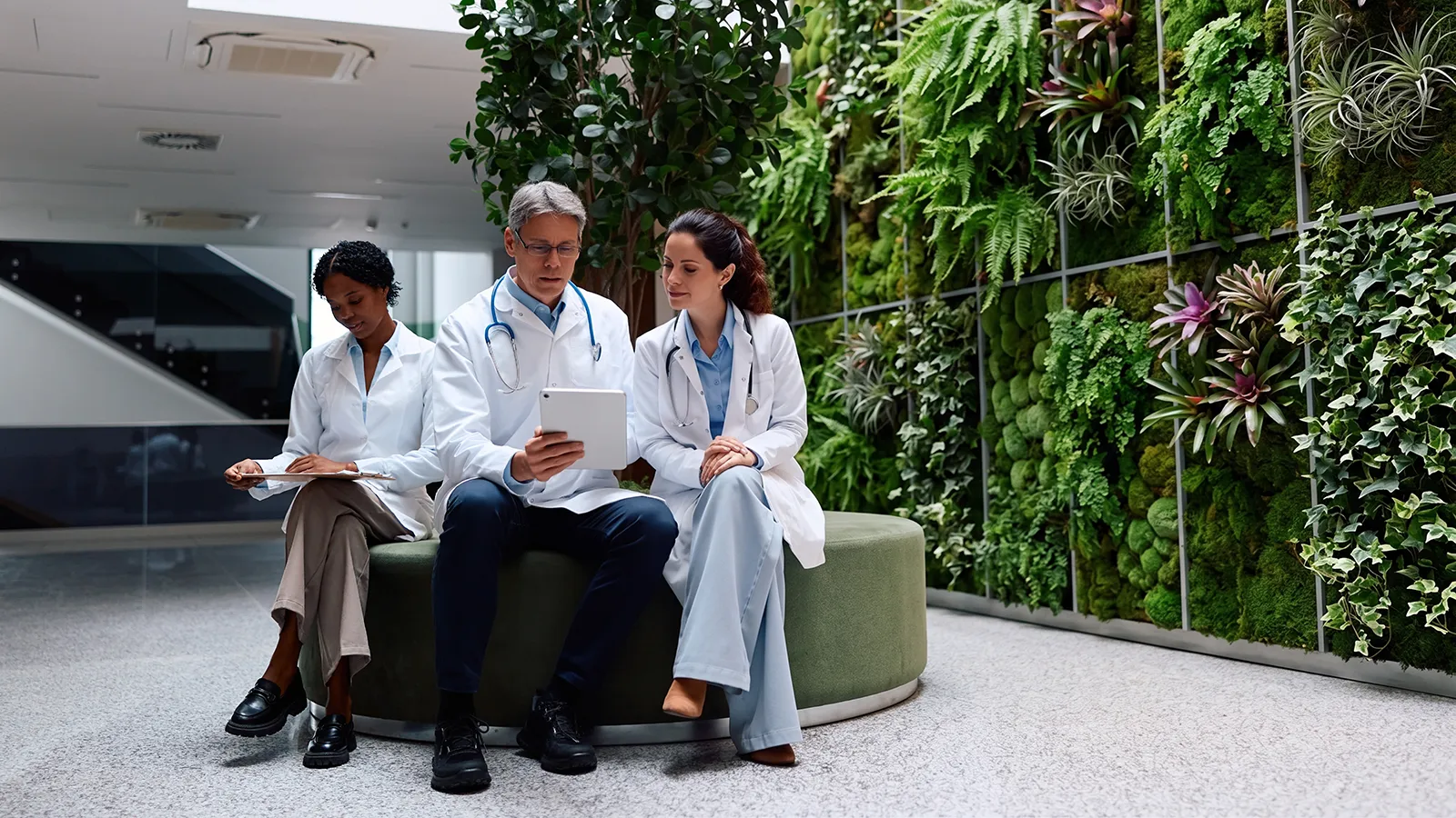 Hospital Biophilic Design With a Living Plant Wall Hospital biophilic design featuring an architectural living plant wall in a healthcare atrium