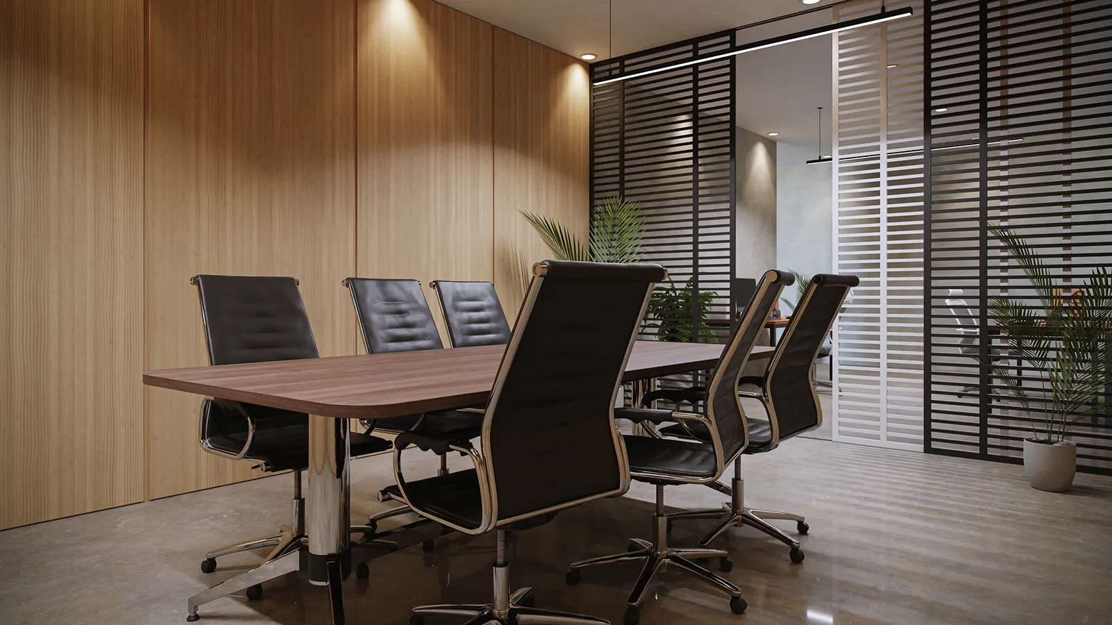 Contemporary commercial meeting room with a conference table, presentation screen, and decorative indoor plants.
